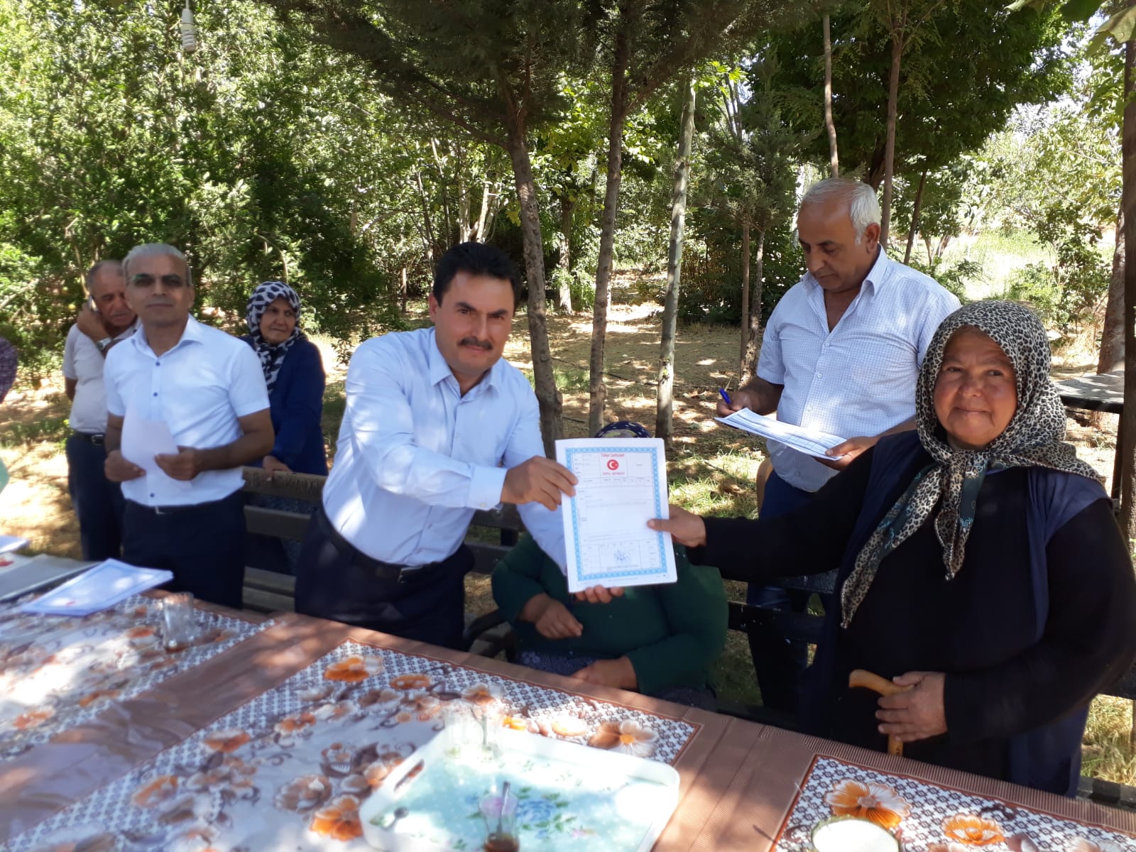 DOĞANPINAR BARAJI YAPIMI NEDENİYLE EVLERİ BARAJ GÖLETİ ALTINDA KALAN YENİ YERLEŞİM YERİNE AİT TAPULAR DAĞITILDI